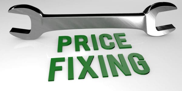 Steel alloy spanner with 'PRICE FIXING' in green text, illustrating the concept of anti-competitive activity,