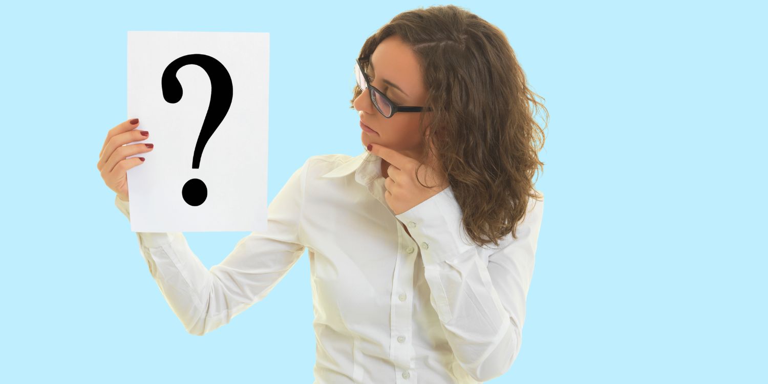 Woman holding a sign with a question mark, looking thoughtfully as she considers how to gather information about a company director.