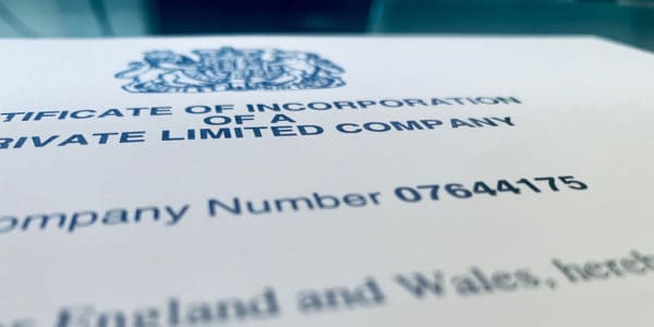 A close-up shot of a Certificate of Incorporation, focusing on the company registration number.