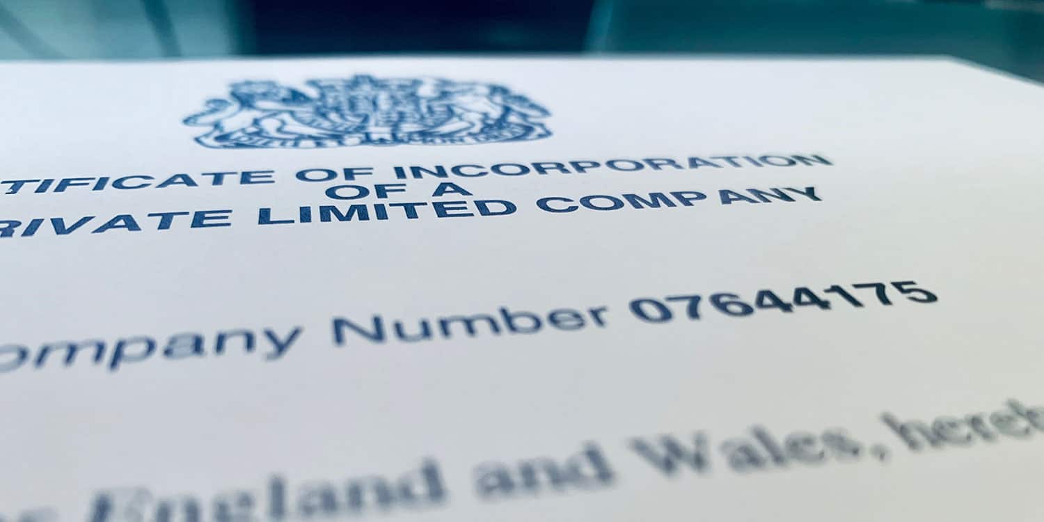 A close-up shot of a Certificate of Incorporation, focusing on the company registration number.