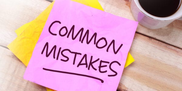 Image of pink Post-It note with the words 'Common Mistakes' hand-written on it.