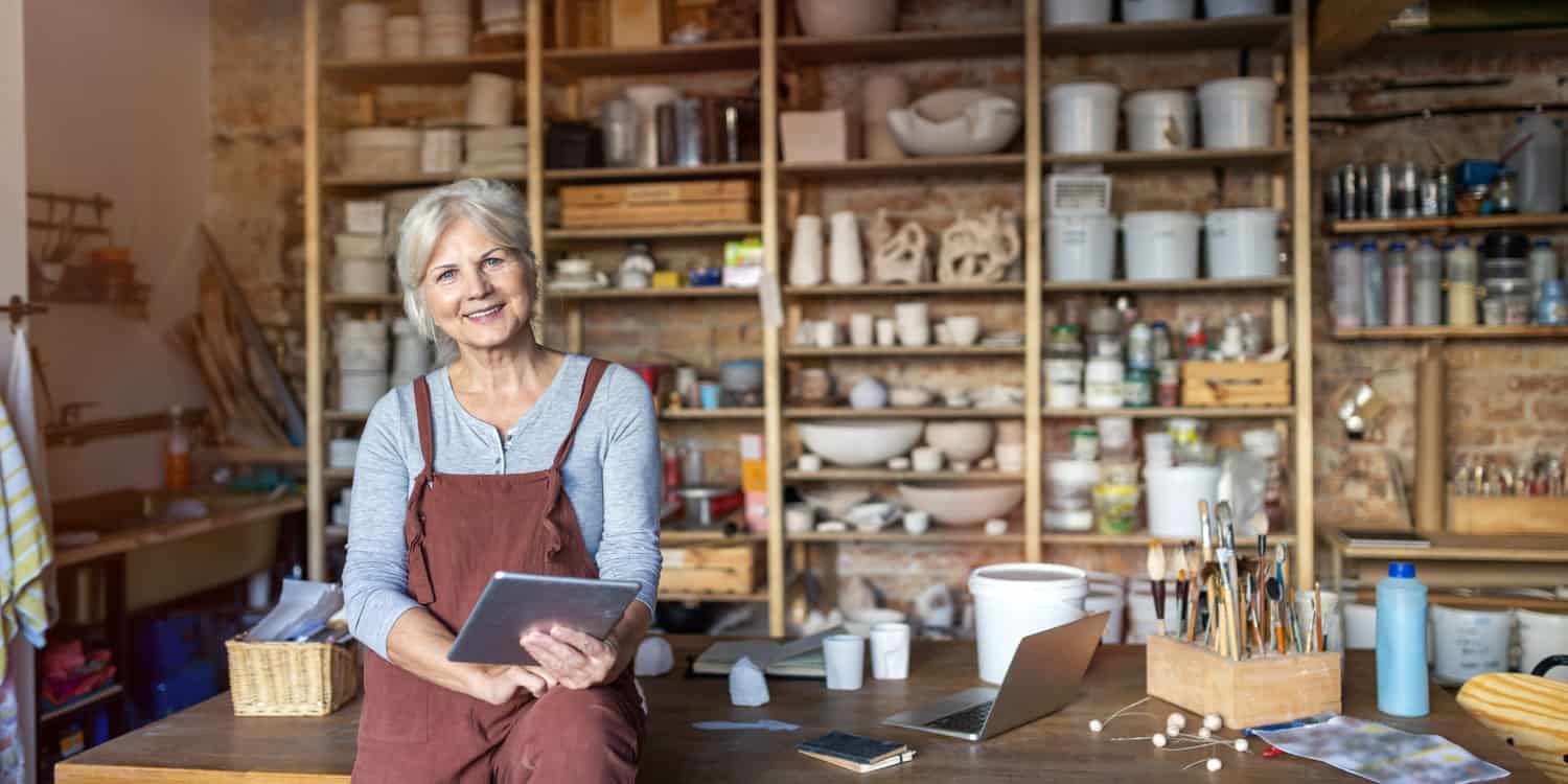Image of a woman wearing an apron, working in a studio.