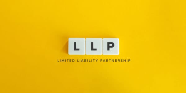 LLP (Limited Liability Partnership) banner and concept. Block letters on bright orange background.