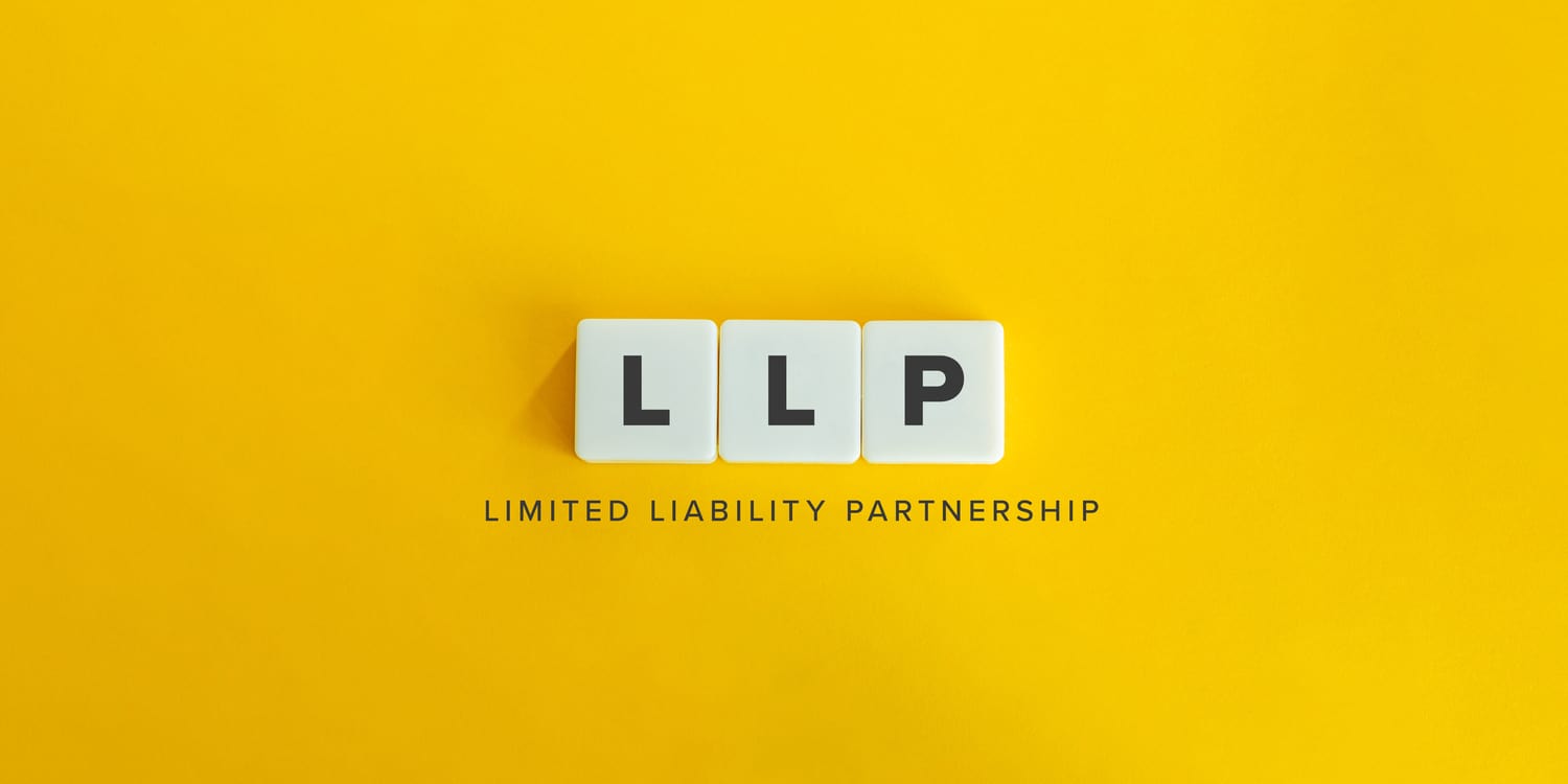 LLP (Limited Liability Partnership) banner and concept. Block letters on bright orange background.