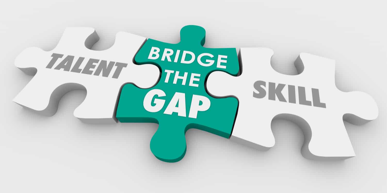 Three jigsaw pieces illustrating TALENT, SKILL and BRIDGE THE GAP..