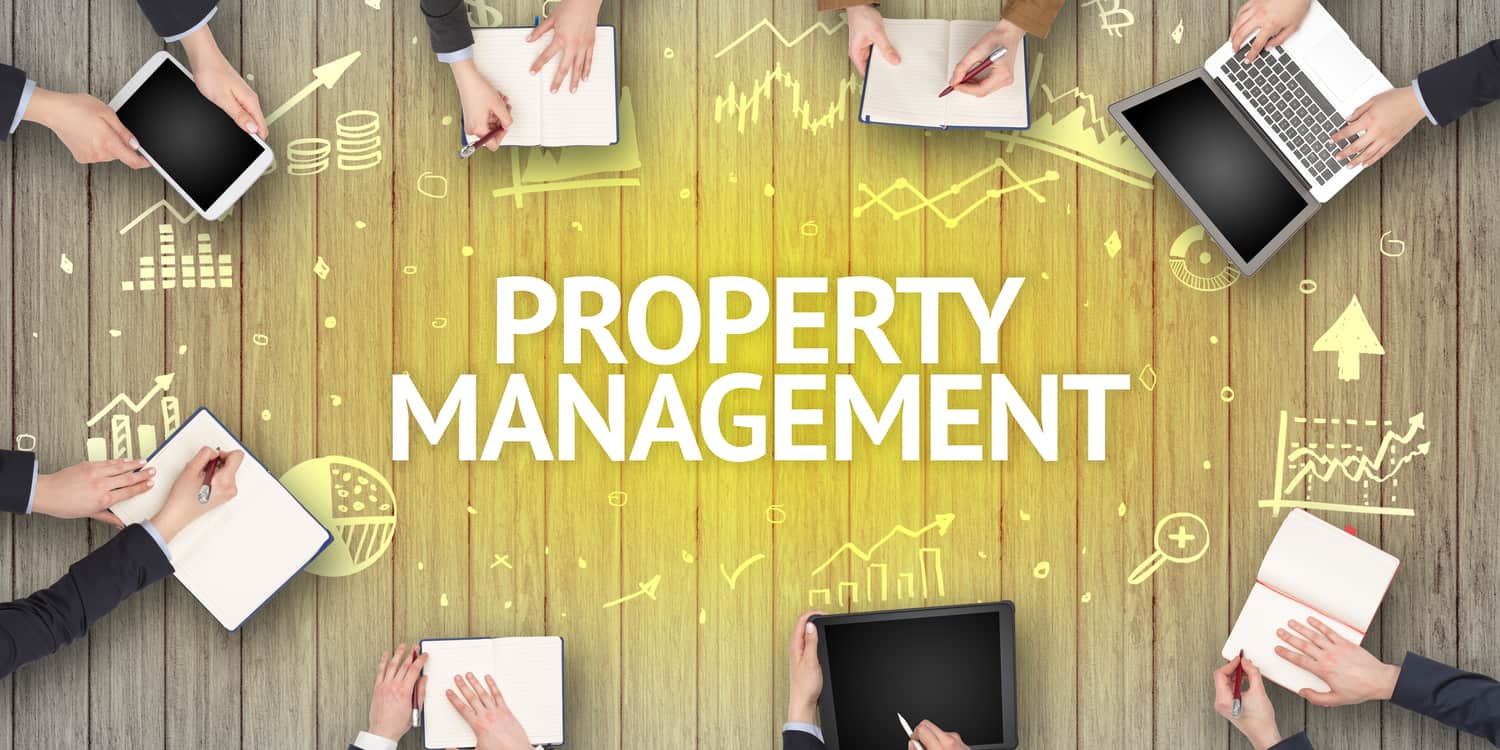 Group of busy people working in an office with PROPERTY MANAGEMENT inscription.