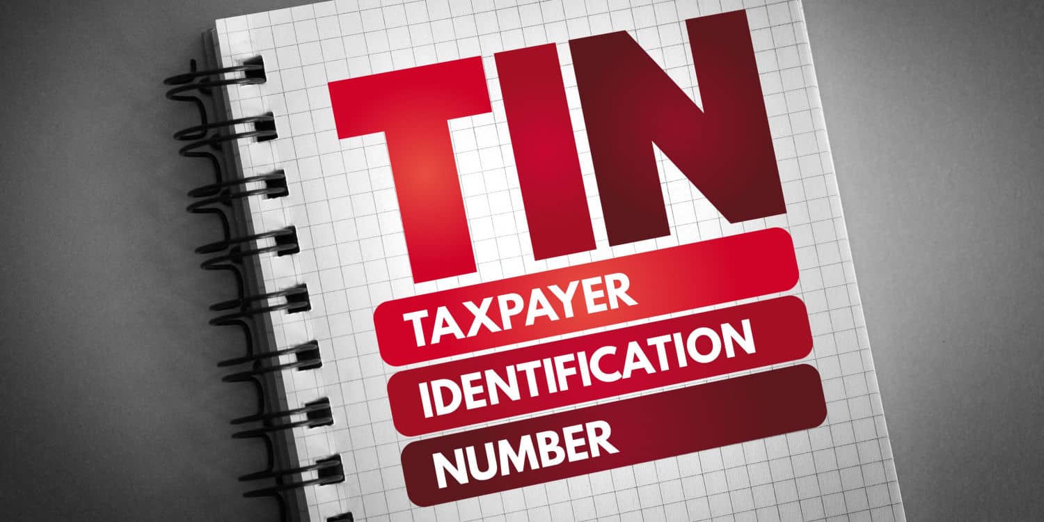 TIN - Taxpayer Identification Number printed in red headline text on the front of a notepad.
