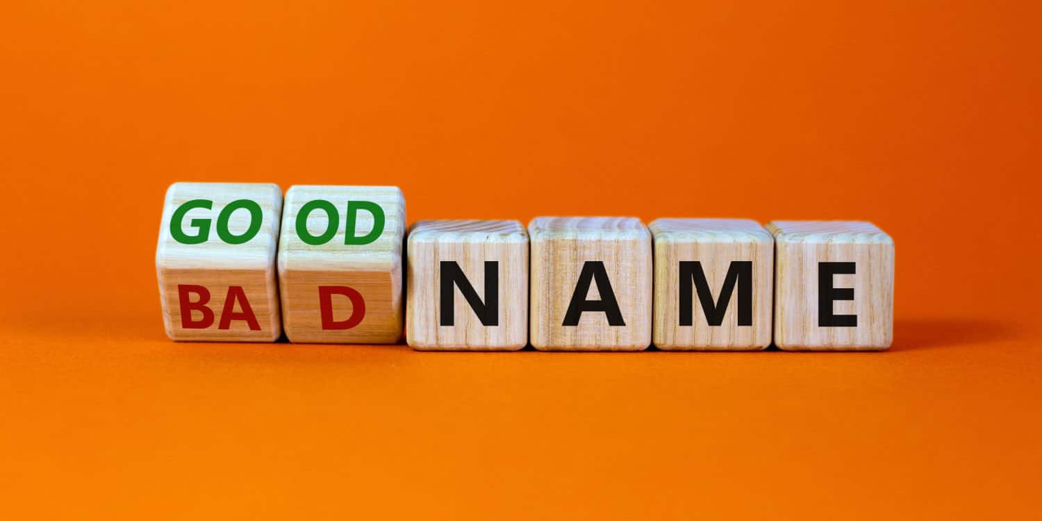 Turned wooden cubes and changed words 'bad name' to 'good name' with orange background.