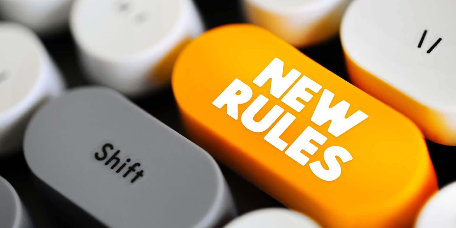 Orange NEW RULES button on keyboard illustrating the changes to UK company law concept.