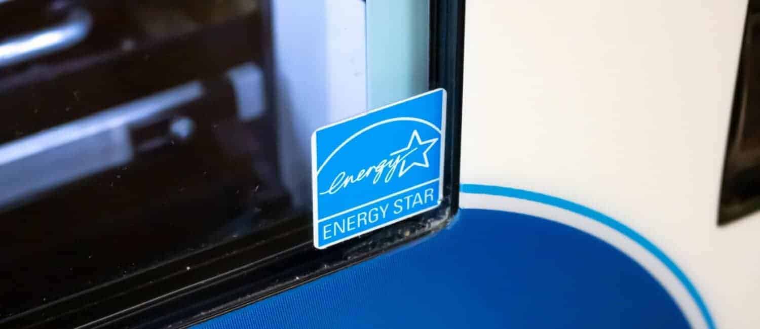 Corner of a laptop screen with a blue ENERGY STAR sticker illustrating that it meets energy-efficiency specifications